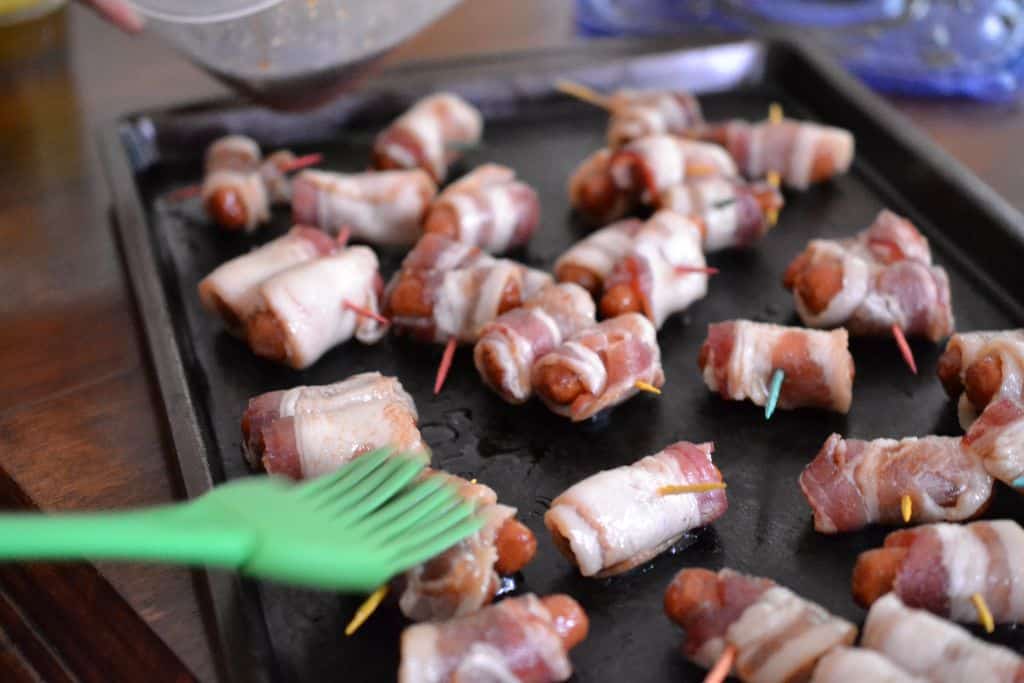 Bacon Wrapped Little Smokies are basted with a sweet brown sugar glaze that gives them the perfect touch of sweetness