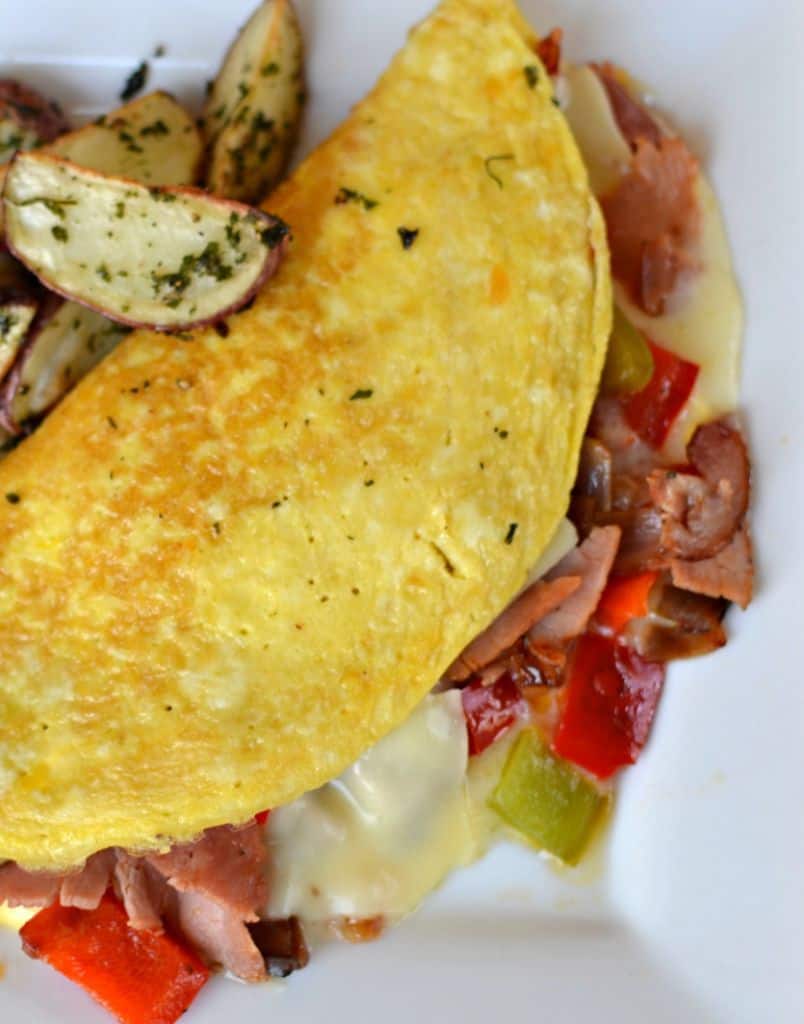 A Denver omelette with onions, bell peppers, ham, and cheddar cheese. 
