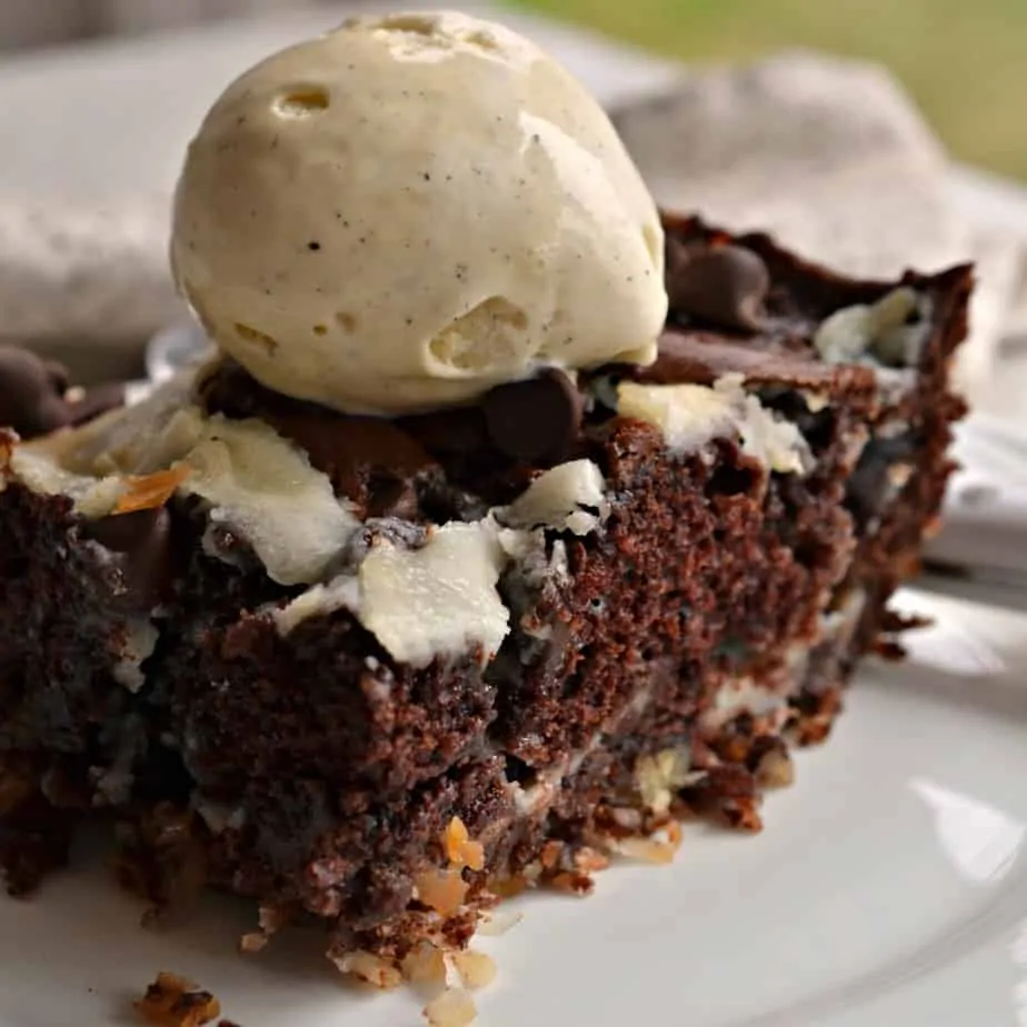 Earthquake Cake is an ooey gooey scrumptiously moist chocolate cake with pockets of cream cheese, pecans and coconut.