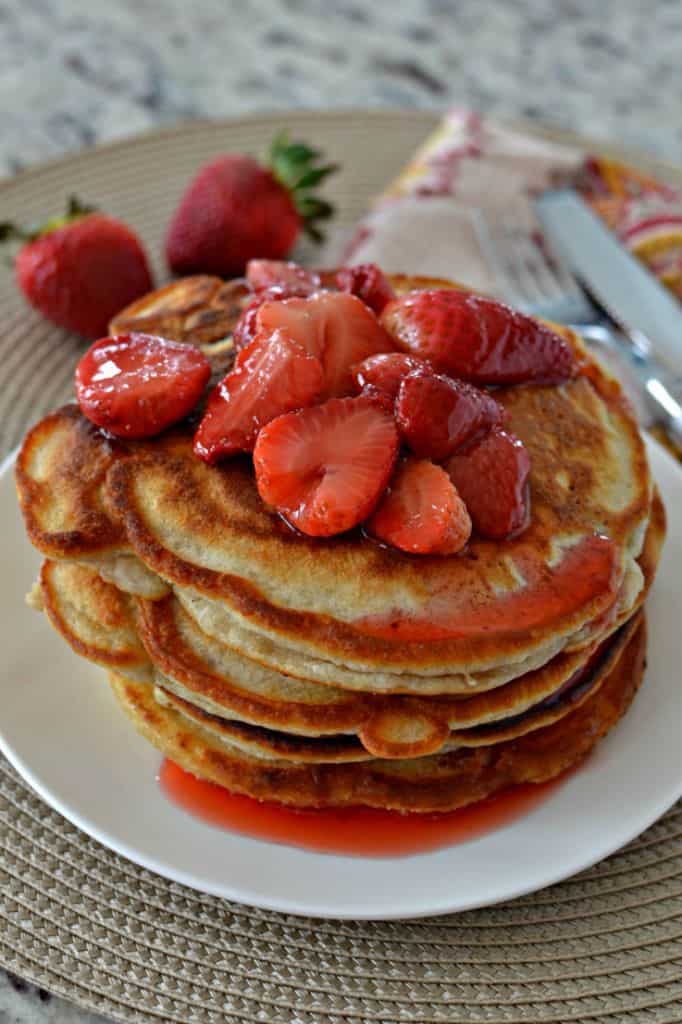 These light and fluffy strawberry pancakes are perfectly paired with an easy homemade strawberry syrup.