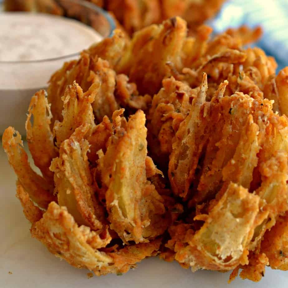 An easy recipe for crispy Blooming Onions that is just as tasty if not better than any Outback restaurant. 