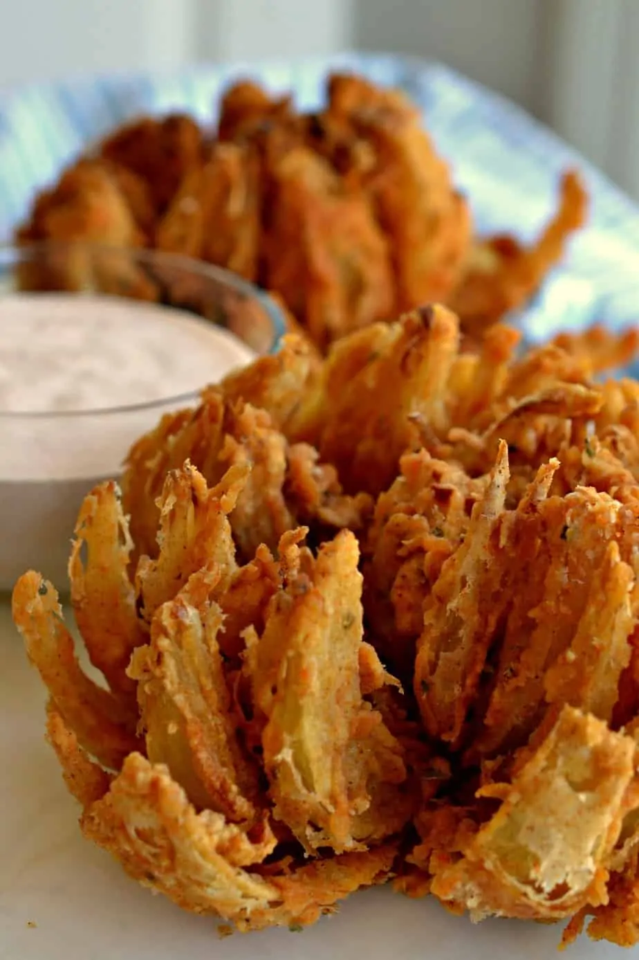 Make a delicious blooming onion for your family today and don't forget the tasty dipping sauce.