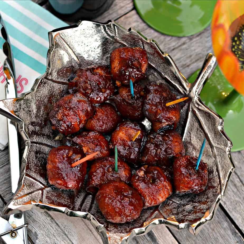 A delectable easy party appetizer of bacon wrapped water chestnuts basted in a seven ingredient Asian sauce. 