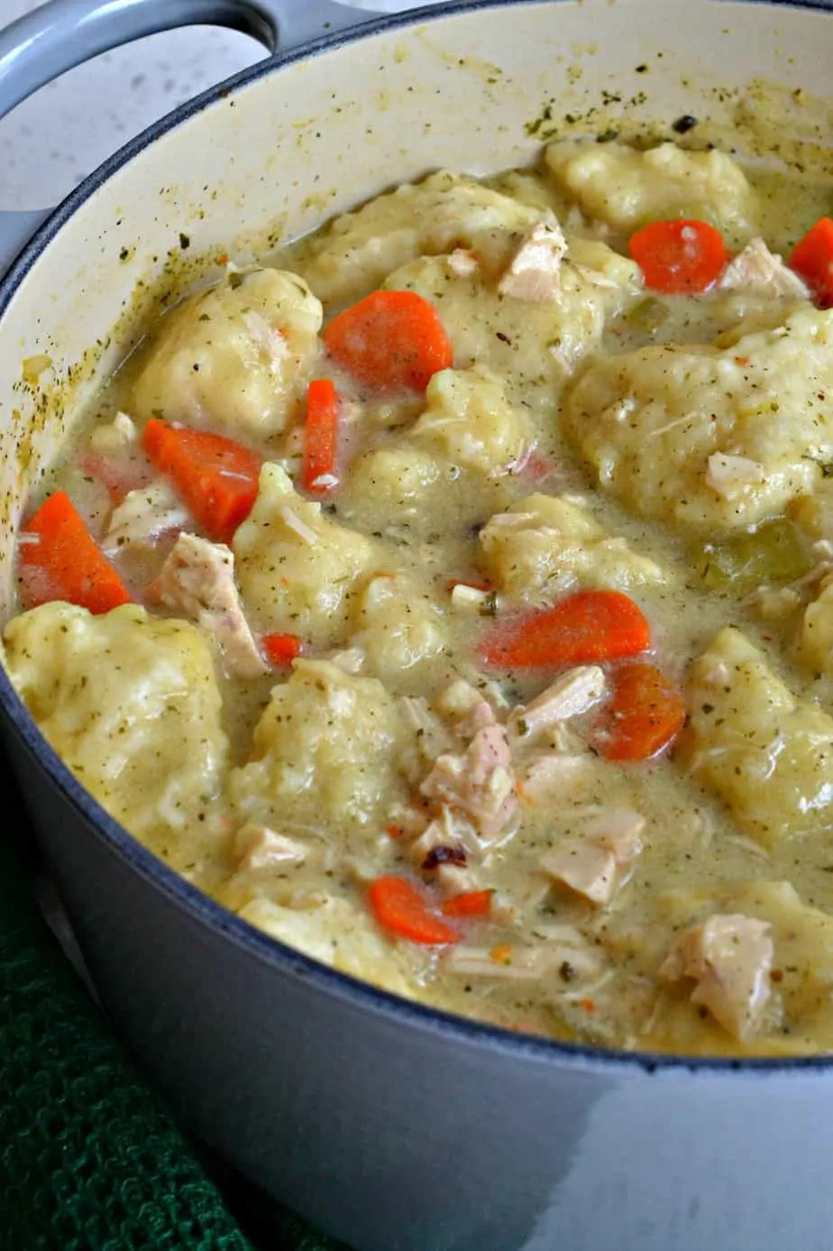 This Chicken and Dumpling Soup recipe is made with creamy broth, succulent chicken, sweet carrots and light fluffy dumplings.
