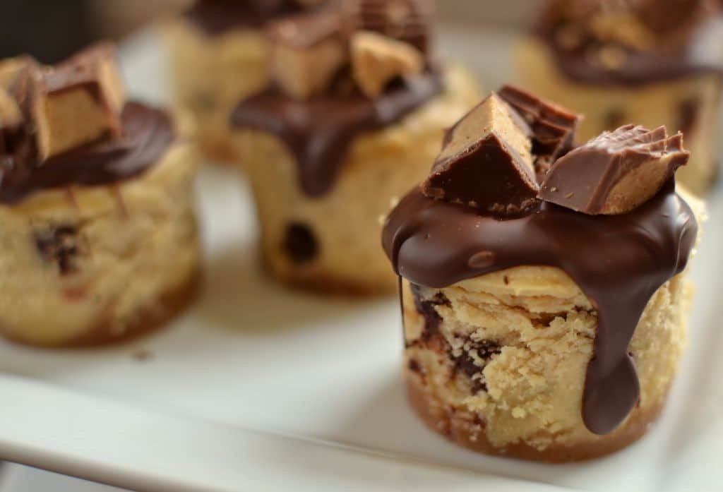 A plate full of mini peanut butter cheesecakes