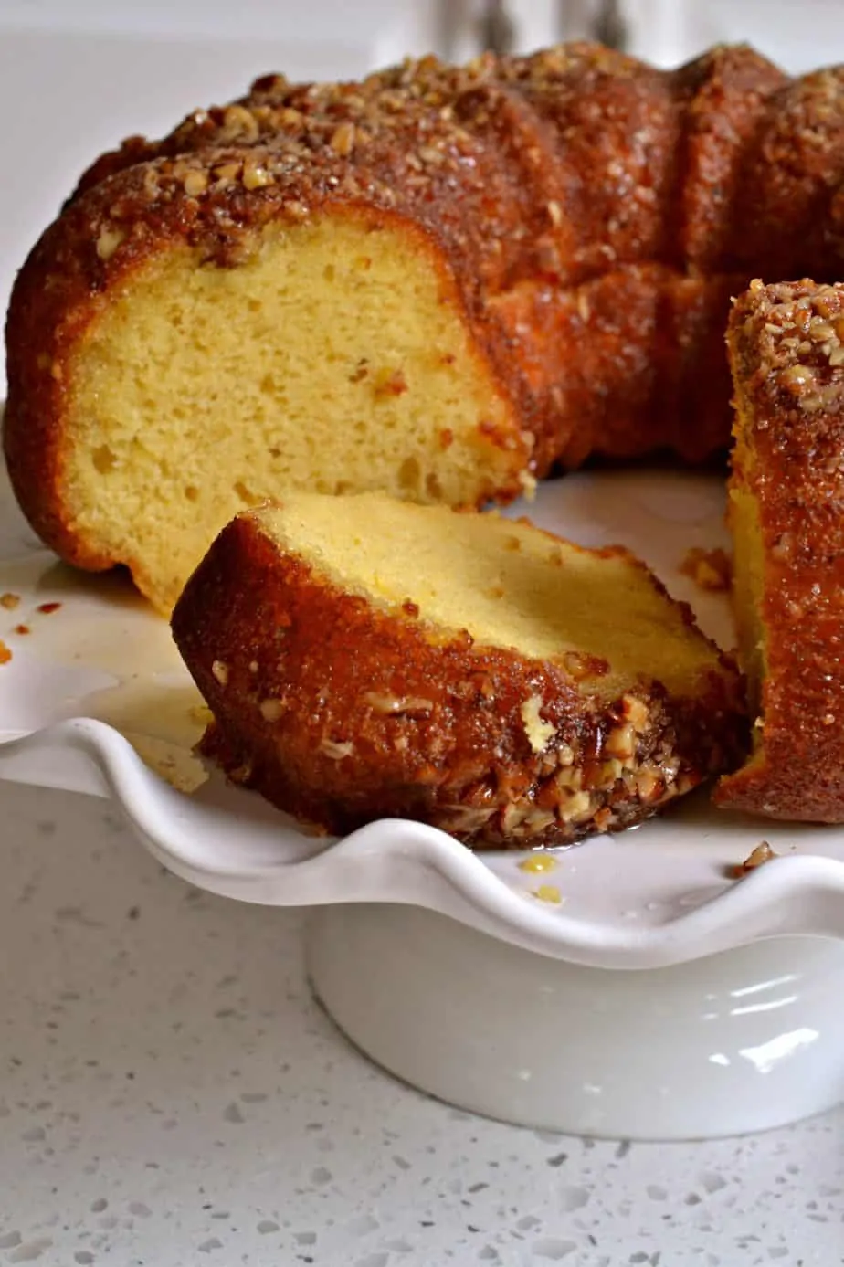 This rum cake is made super simple with a yellow butter cake mix but tastes just as delicious as a cake made from scratch.