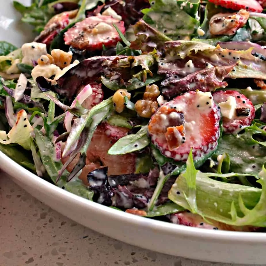 Sweet and crunchy Strawberry Spinach Salad with poppy seed dressing is the perfect spring and summer salad. 