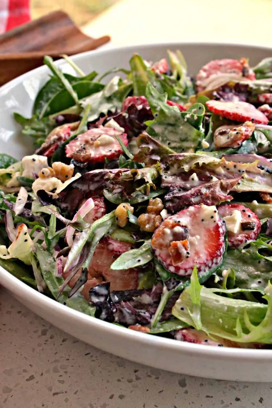This Strawberry Spinach Salad with homemade poppy seed dressing is always a hit for spring and summer gatherings. 