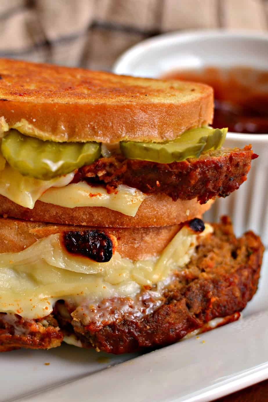 These Grilled Meatloaf Sandwiches are delicious slices of meatloaf with glaze between two slices of buttery toast and plenty of melty cheese.