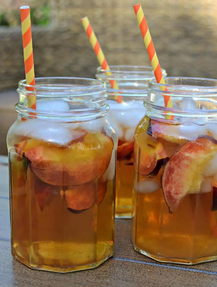 A cool refreshing homemade peach tea made with fresh simmered peaches and tea bags.