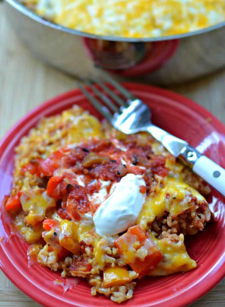 This easy fantastic Chicken Fajita Casserole combines delectable chicken breasts marinated in fajita seasoning, red and orange bell pepper, brown rice, and salsa-style tomatoes. 