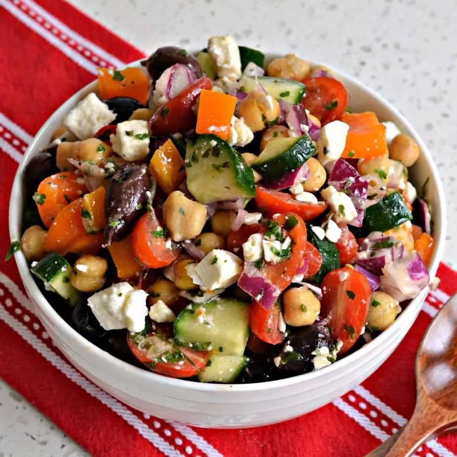 An easy Mediterranean Salad made with chickpeas, cucumbers, onions, bell peppers and feta cheese with a lemon vinaigrette. 