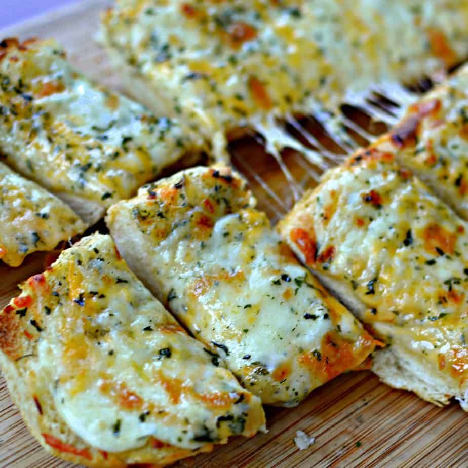 Triple Cheese Garlic Bread combines mozzarella, provolone and cheddar on soft crusty Italian or French bread.