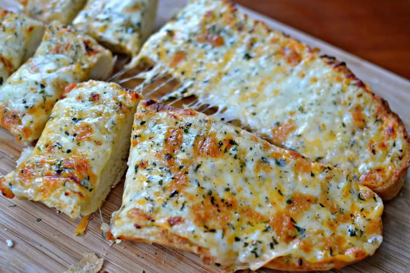 A easy to make loaf of French bread topped with garlic butter, mozzarella, cheddar, provolone and baked to perfection.