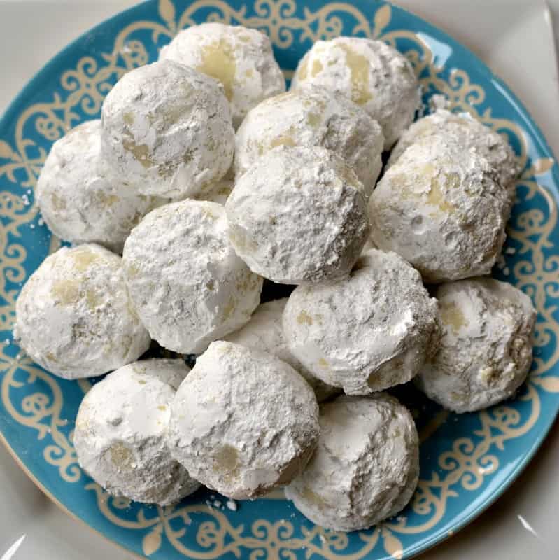 You might know them as Russian Tea Cakes, Italian Wedding cookies, butter balls, and Mexican Wedding Cookies but in our house, we just call them Snowballs