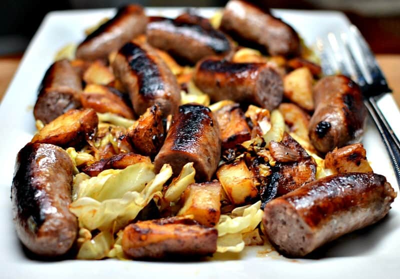 This Sweet Mustard Brats and Cabbage recipe combines beer brats, crispy cooked potatoes, onions, and sauteed cabbage in a lightly sweetened mustard sauce. 