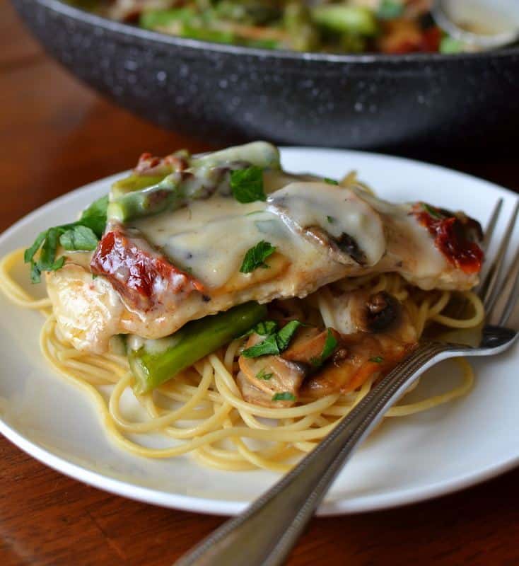 Creamy mushrooms, sun dried tomatoes and asparagus over a bed of tender spaghetti
