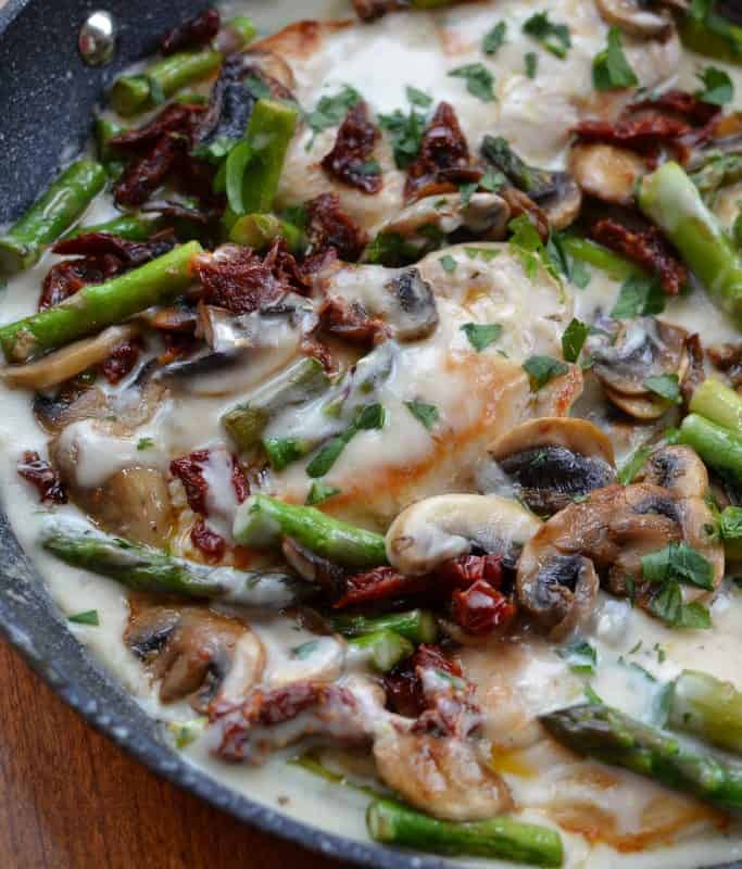 Creamy mushroom chicken skillet with asparagus and sun dried tomatoes