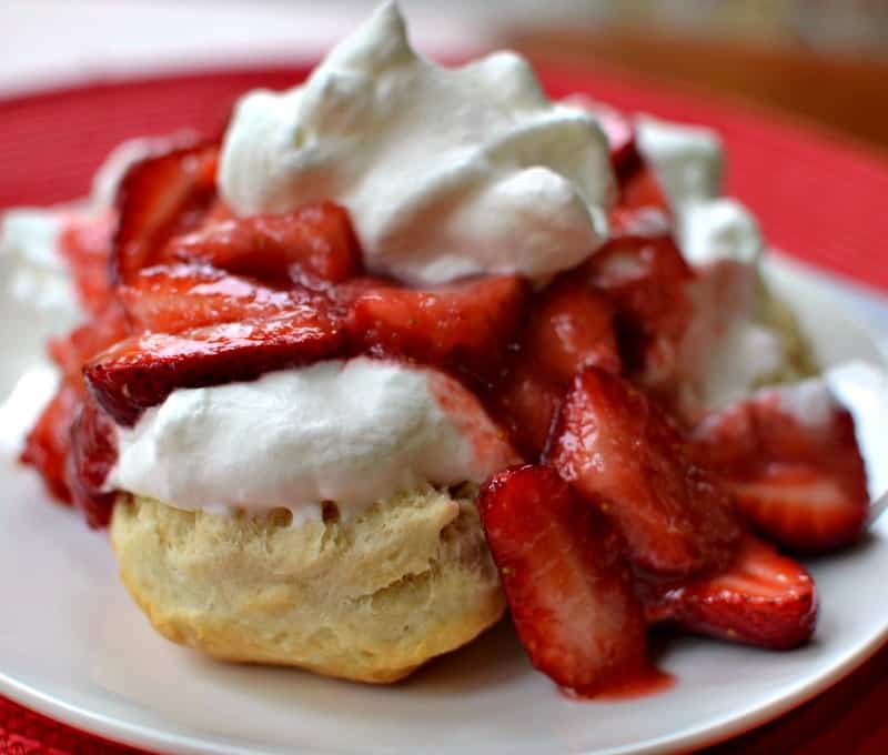The best homemade strawberry shortcake recipe is made with buttermilk biscuits topped with fresh whipped cream and fresh, juicy strawberries