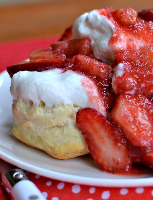 This delicious strawberry shortcake recipe has fresh, sweet strawberries served over fresh whipped cream and warm, homemade biscuits