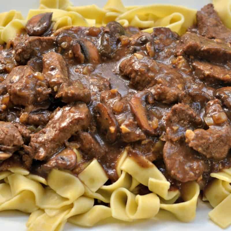Melt in your mouth beef with browned mushrooms and an easy red wine gravy. 