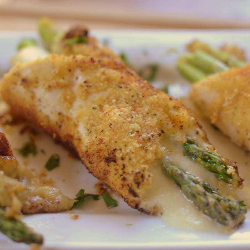 Breaded chicken breast stuffed with tender asparagus and parmesan cheese