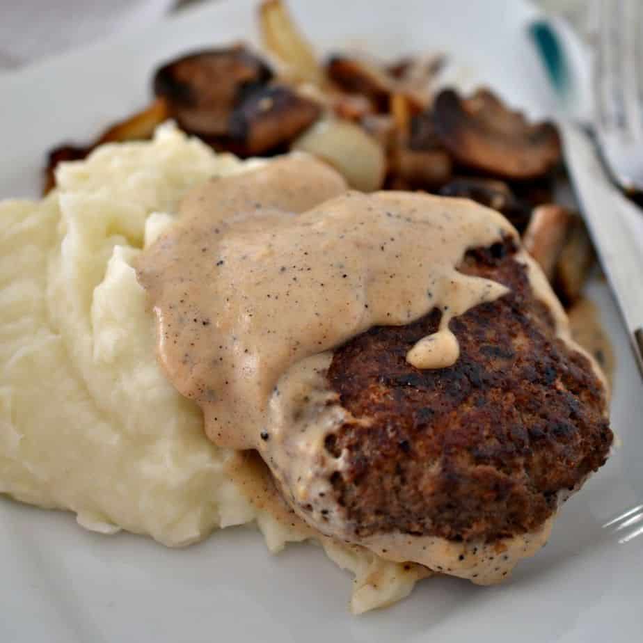 Serve hamburger steak over rice, noodles, or mashed potatoes with a side of roasted carrots, steamed broccoli, or southern green beans.