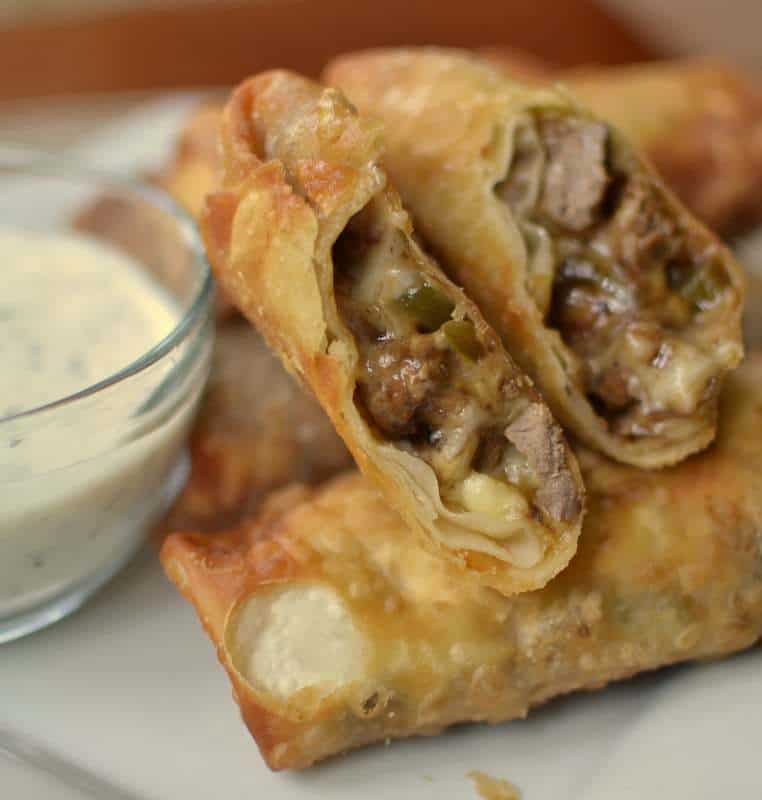 Steak, peppers and provolone cheese make these philly cheesesteak egg rolls a delicious party treat