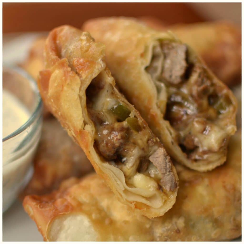 Homemade steak and cheese egg rolls have sweet green peppers and creamy provolone cheese.