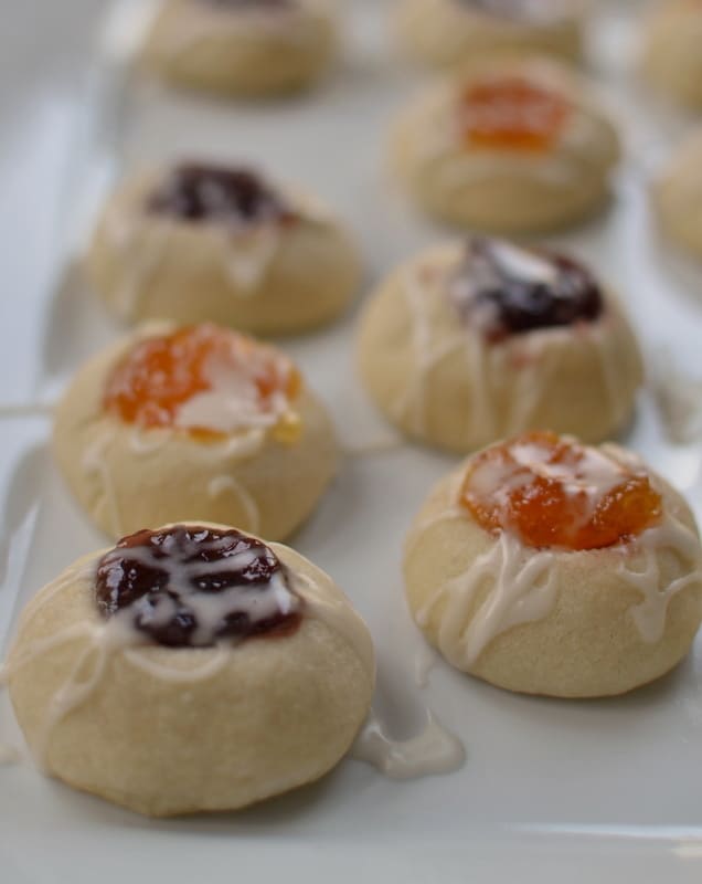 Deliciously sweet Shortbread Thumbprint Cookies filled with apricot, blackberry, and cherry jam