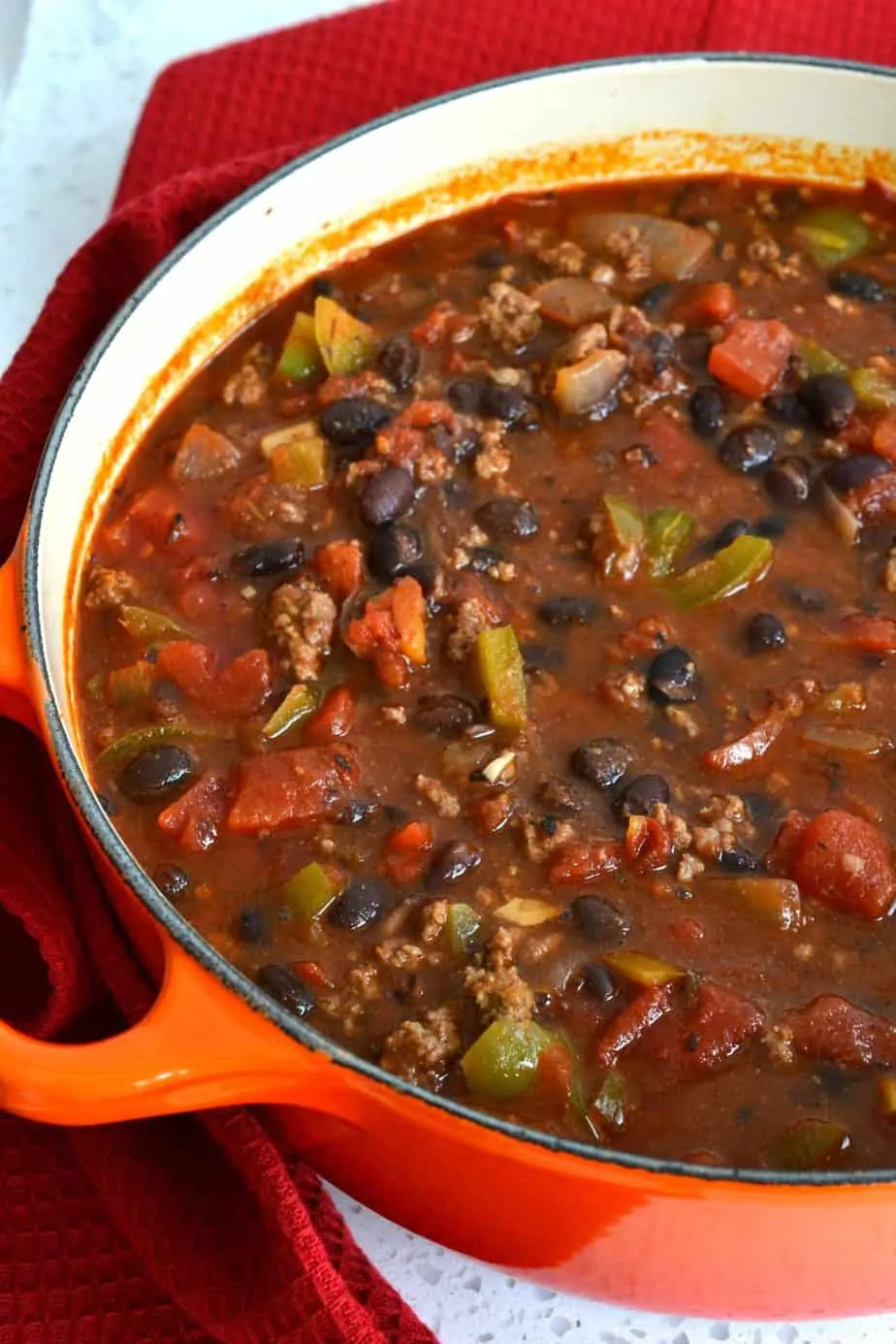 Now stir in the fire-roasted tomatoes, beef broth, and black beans.  Simmer for about 10 minutes, and then stir in the tomato paste. 