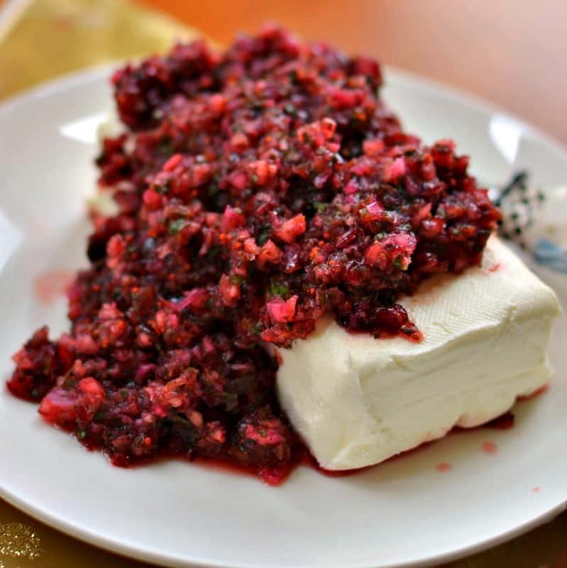 Five Minute Festive Cranberry Salsa combines fresh cranberries, jalapenos, cilantro, red onions, honey, and lime juice into an amazing treat.