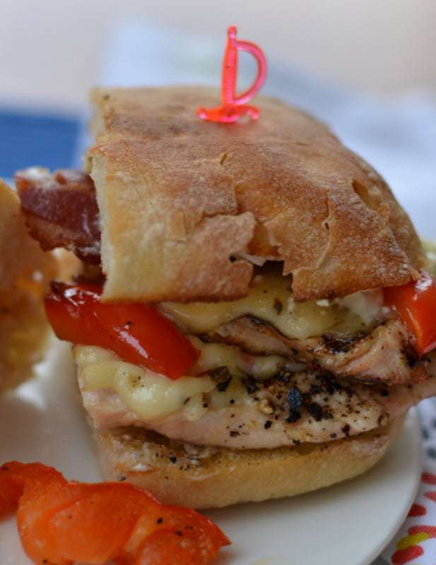 Grilled chicken ciabatta sandwich topped with spicy pepper jack cheese and bacon