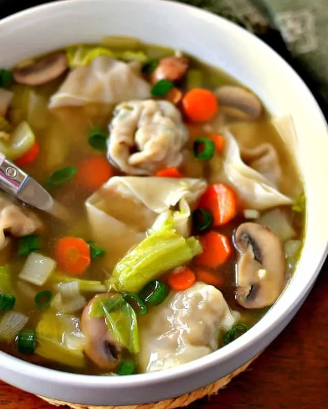 Wonton Soup is full of flavor from tender pork stuffed wontons, onions, mushrooms, carrots, celery, and Napa Cabbage in a perfectly seasoned vegetable broth!