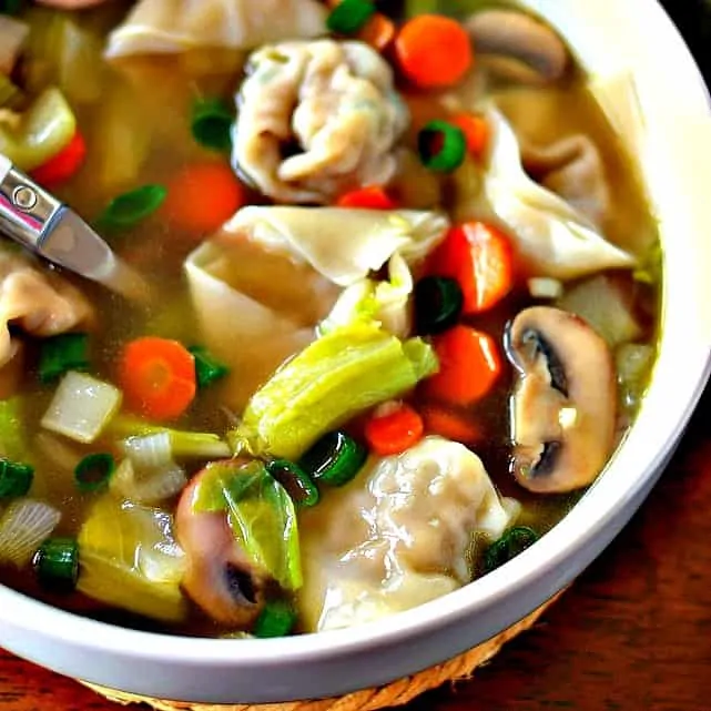 A brothy soup full of sweet pork stuffed dumplings, onions, mushrooms, carrots, celery and Napa cabbage and fresh ginger.