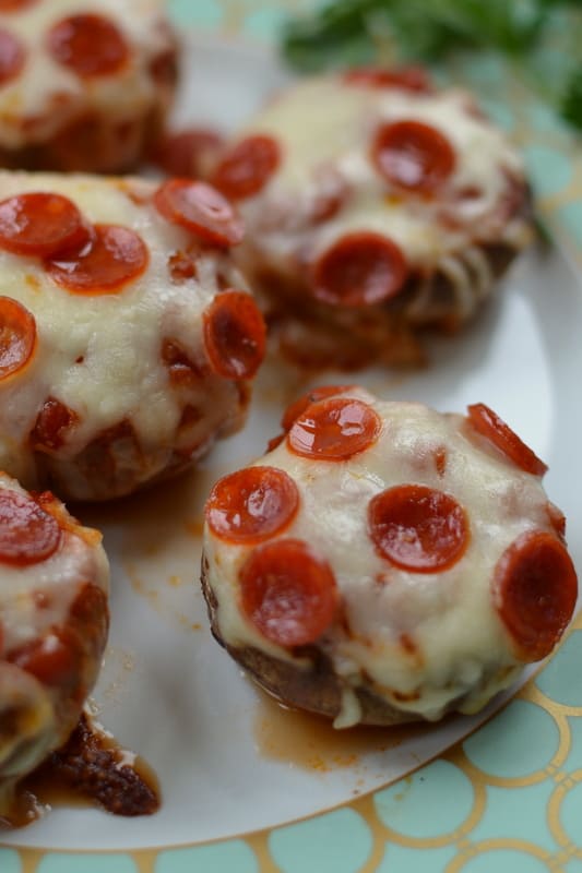 Mushrooms filled with marinara sauce, topped with mini pepperoni and mozzarella cheese