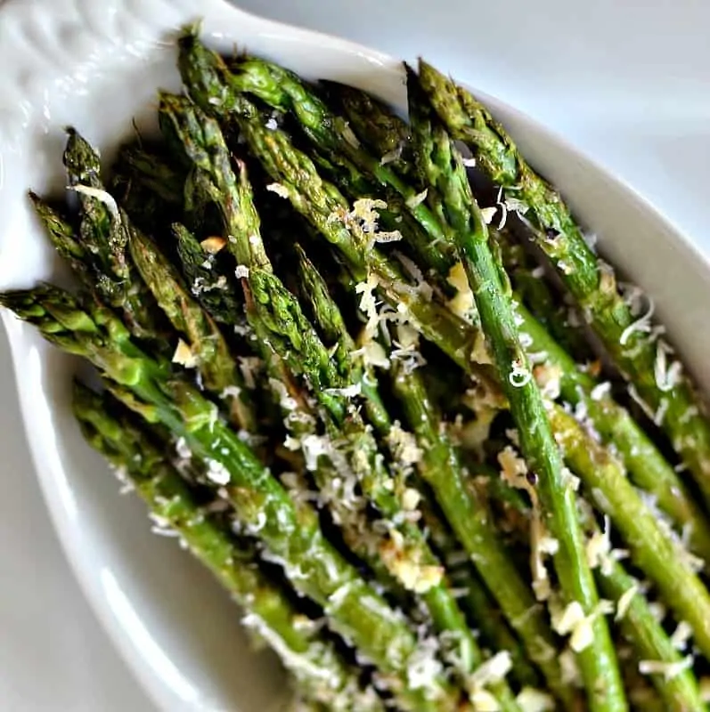 An easy vegetable side dish combining healthy asparagus, minced garlic and freshly grated Parmesan cheese.