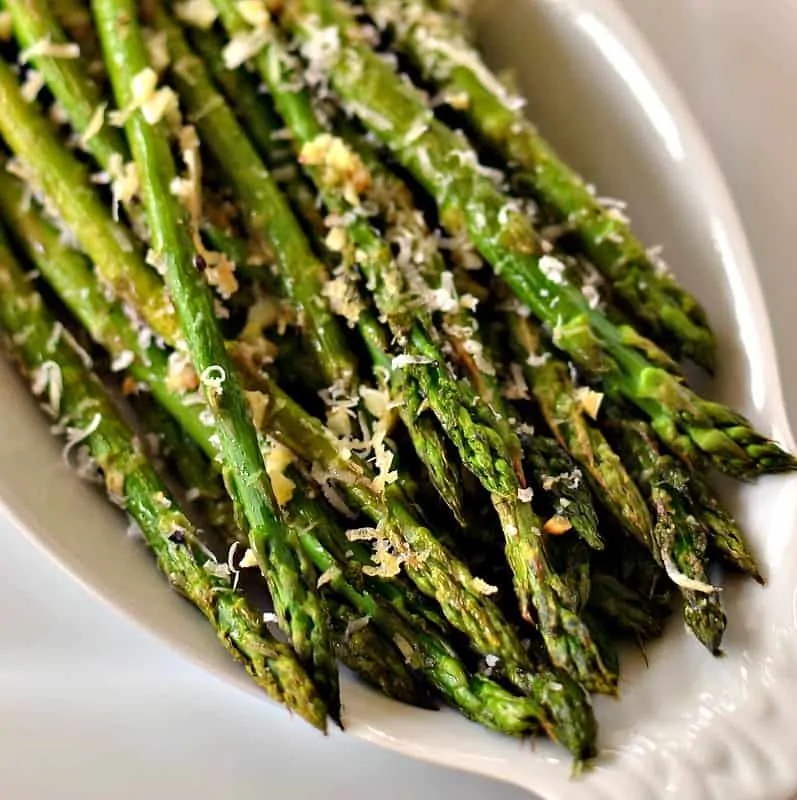 Oven Roasted Parmesan Asparagus is a quick side dish combining asparagus, minced garlic and freshly grated Parmesan Cheese.