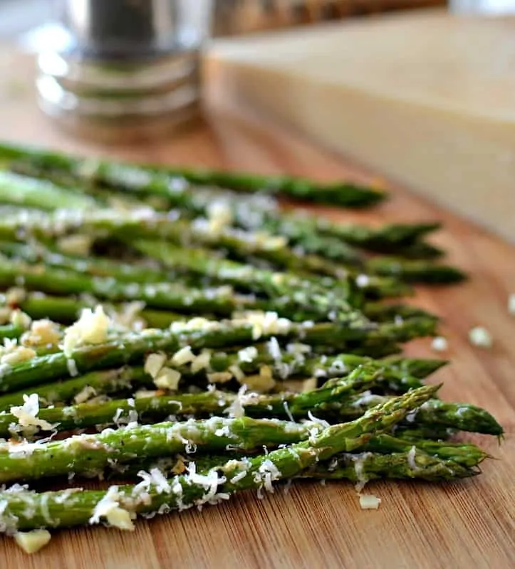 Oven Roasted Parmesan Asparagus is an easy side dish combining healthy asparagus, minced garlic and grated Parmesan Cheese.