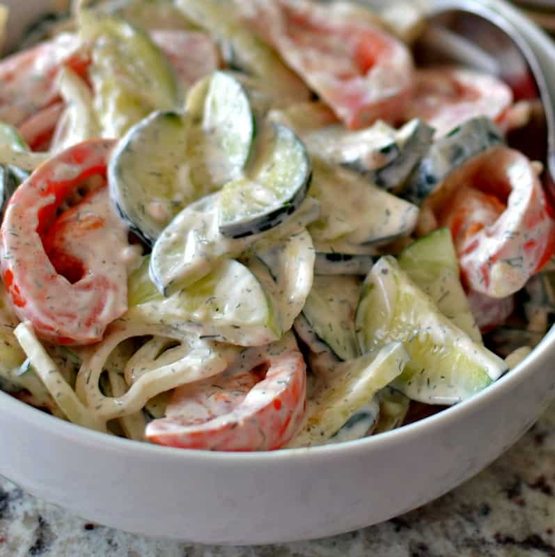 The key to making the best Creamy Cucumber Tomato Salad is picking up good crisp fresh cucumbers, sun-ripened tomatoes, and sweet onions.  