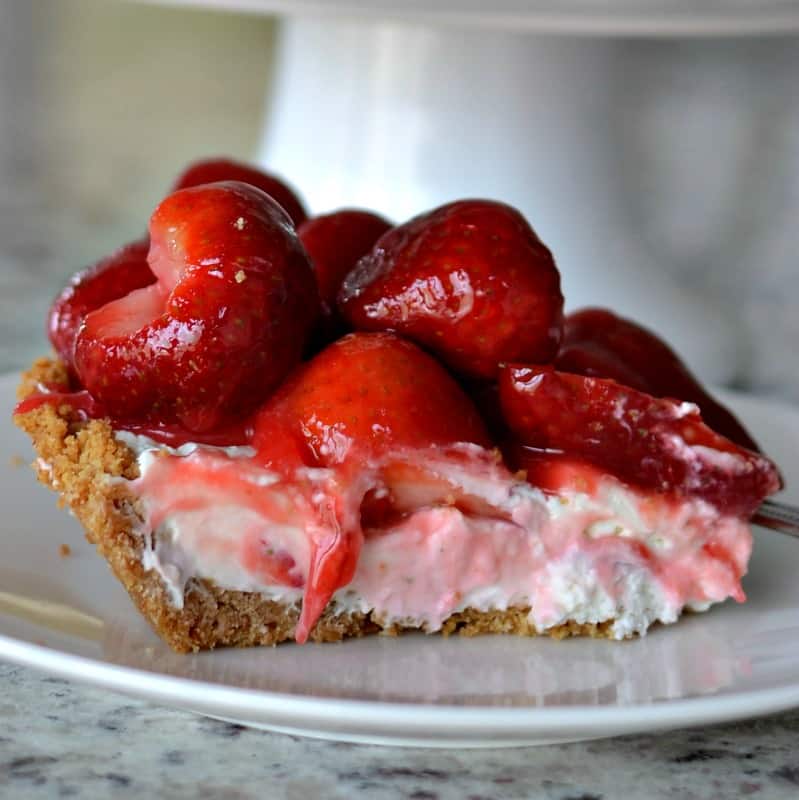 This fresh Strawberry Cream Cheese Pie is a triple-layer delight starting with a three-ingredient graham cracker crust.