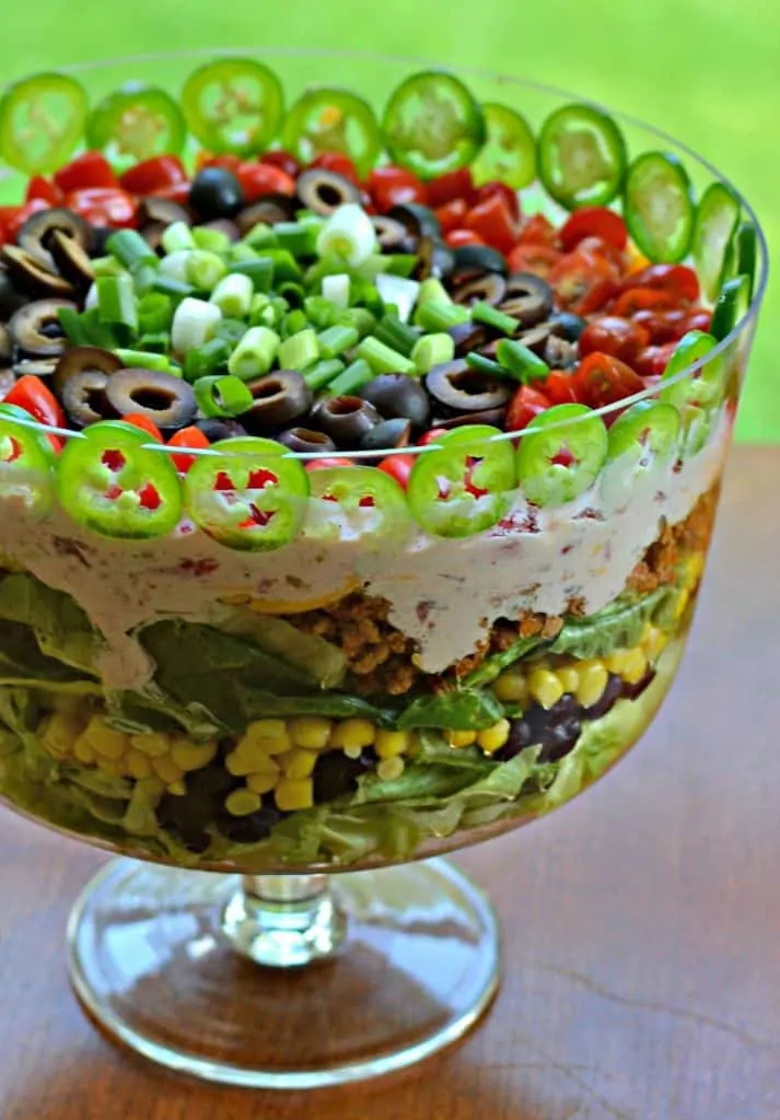 This Layered Taco Salad is as beautiful as it is delicious!  I love to serve it for a luncheon or a Saturday night dinner complete with spicy Bloody Marys.