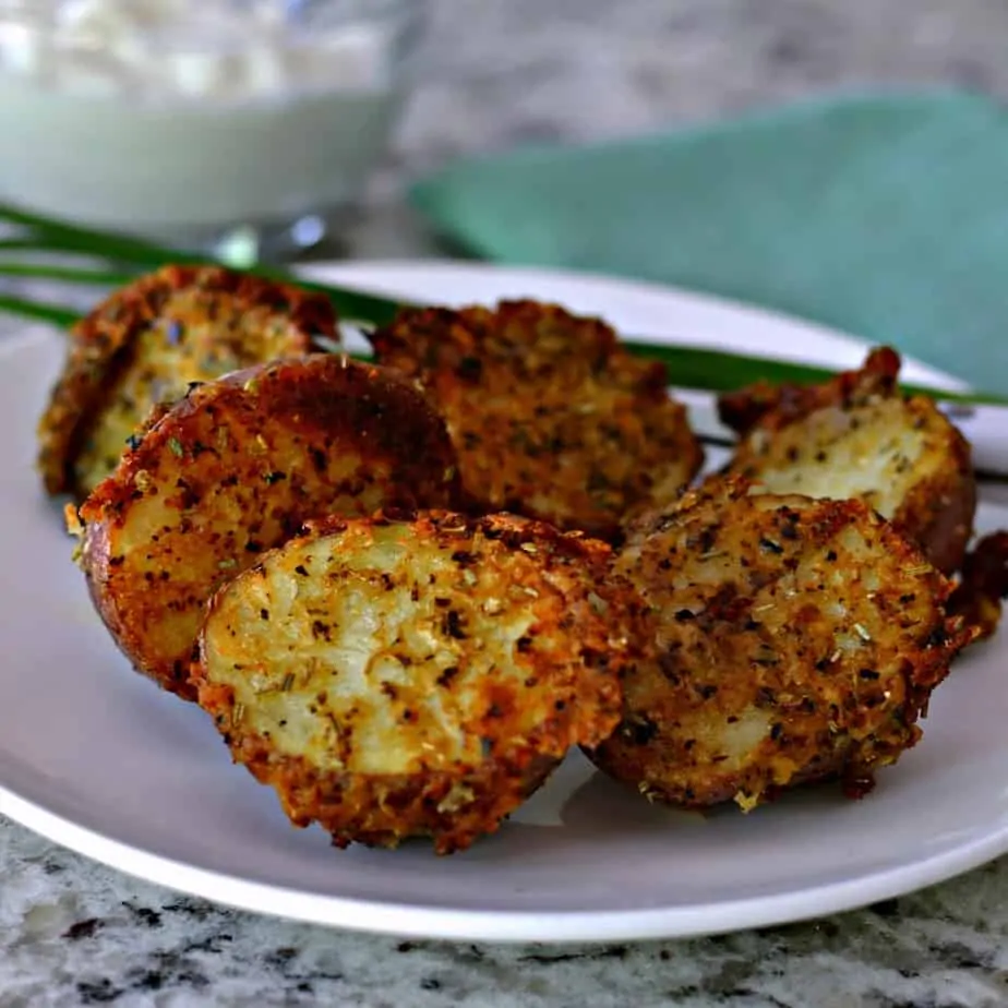 Delectable crispy roasted red potatoes made with fresh Parmesan Cheese, rosemary, oregano and basil.