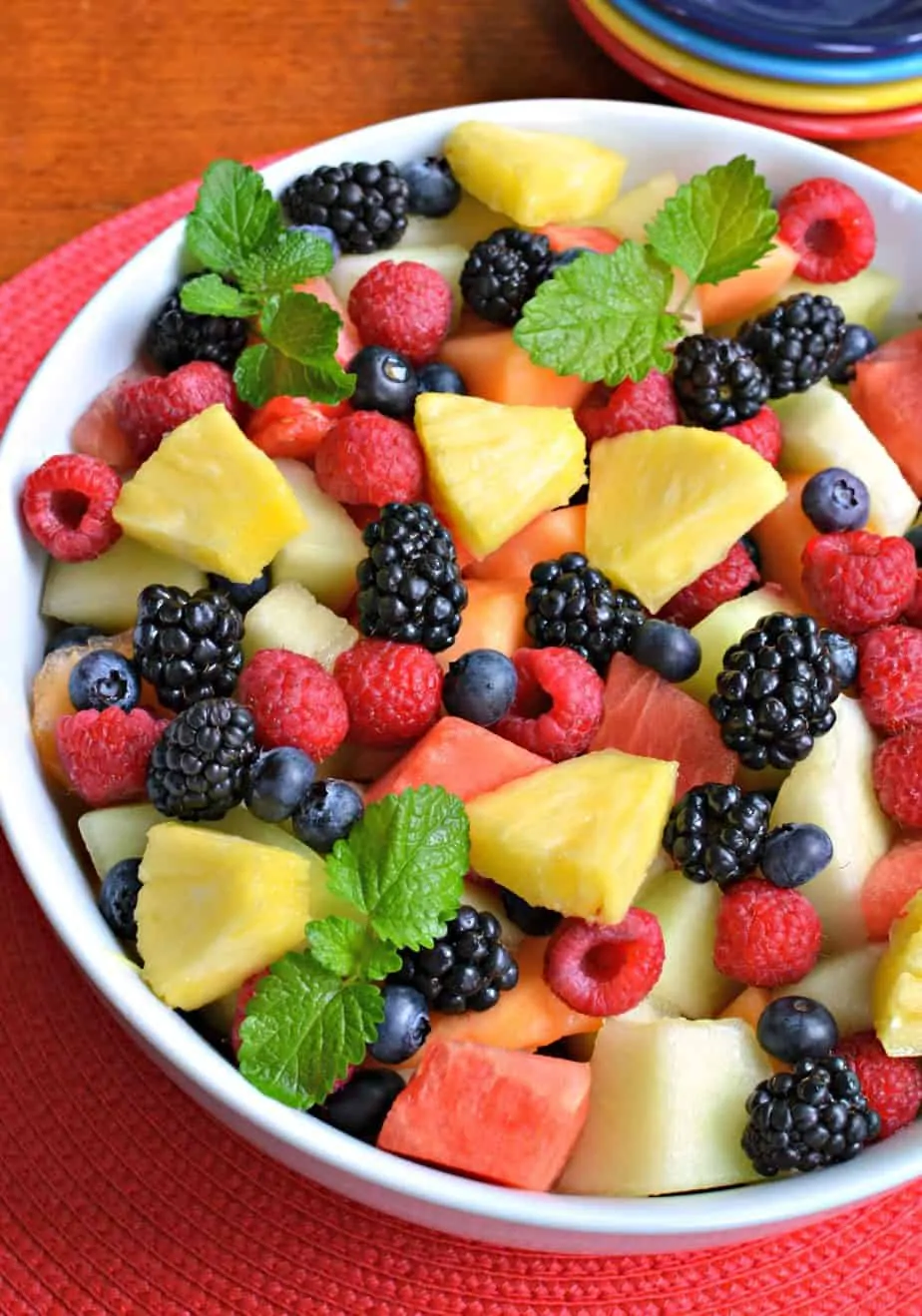 This Summer Fruit Salad combines cantaloupe, honey dew, watermelon, pineapple, raspberries, blueberries and blackberries. 