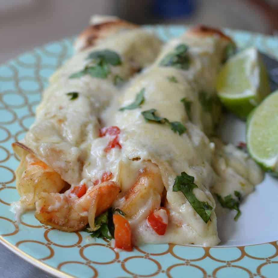 Creamy Shrimp Enchiladas brings together fresh shrimp, shallots, red bell pepper, and garlic, all wrapped up in a creamy Monterrey Jack cheese sauce. 