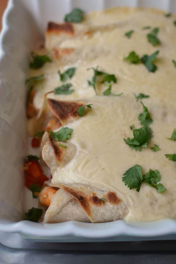 Creamy Shrimp Enchiladas bring together fresh shrimp, shallots, red bell pepper, and garlic all wrapped up in a creamy Monterrey Jack cheese sauce.