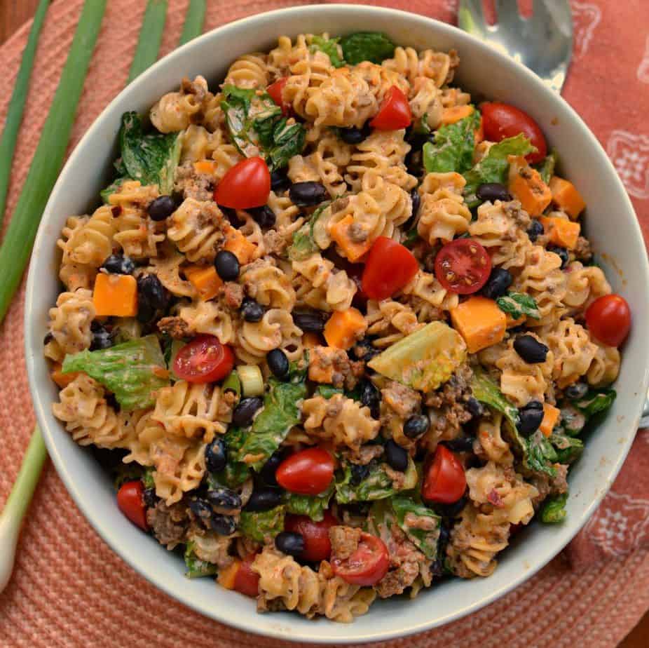 This creamy pasta salad is loaded with taco meat. cheese, tomatoes, and black olives. 