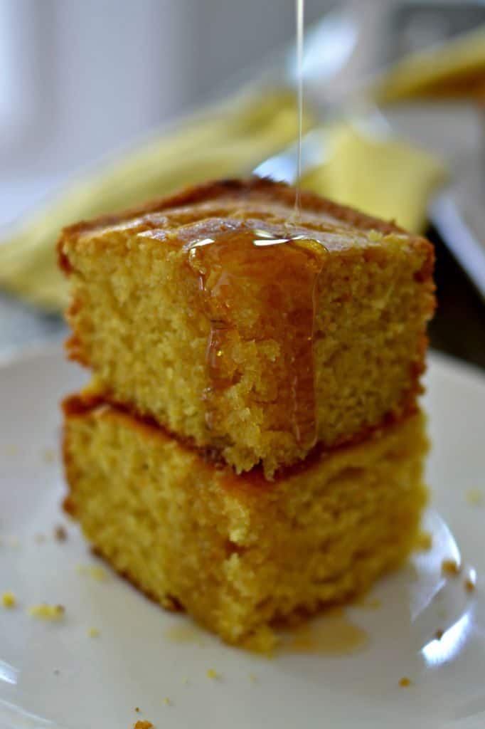The most delicious, sweet, and moist cornbread drizzled with honey