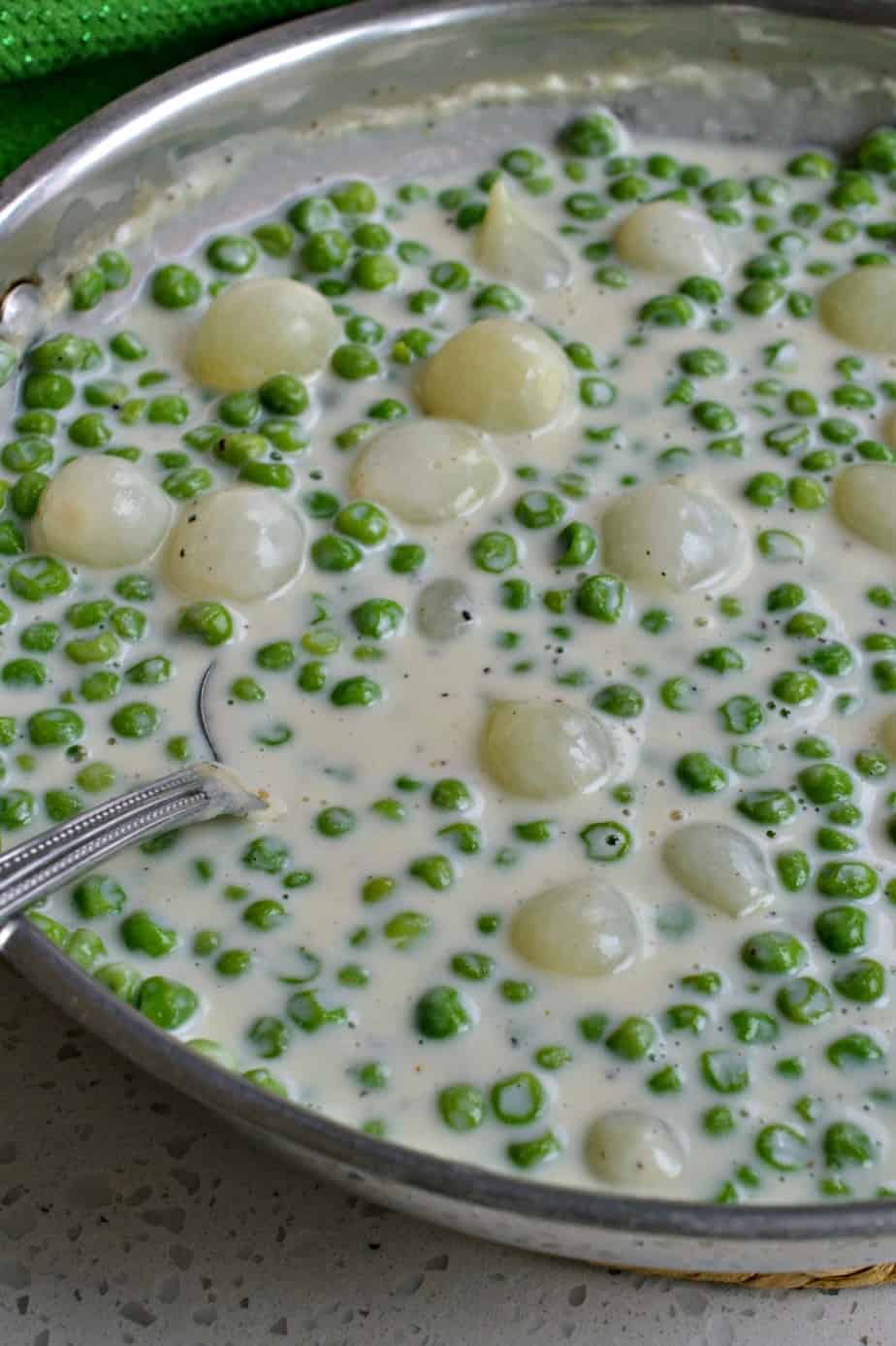 Creamed peas and pearl onions are combined in an easy to make rich creamy sauce. 