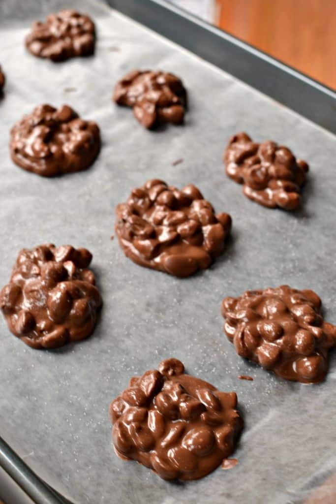 Stir in your peanuts and drop by rounded spoonfuls on wax paper-covered baking sheets and if desired sprinkle with sea salt